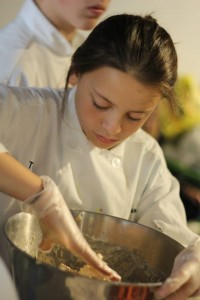 Culinary camp student working on a recipe at campusNYC!