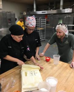 Roni and Dave Working With Pastry Student - Summer Culinary Camp